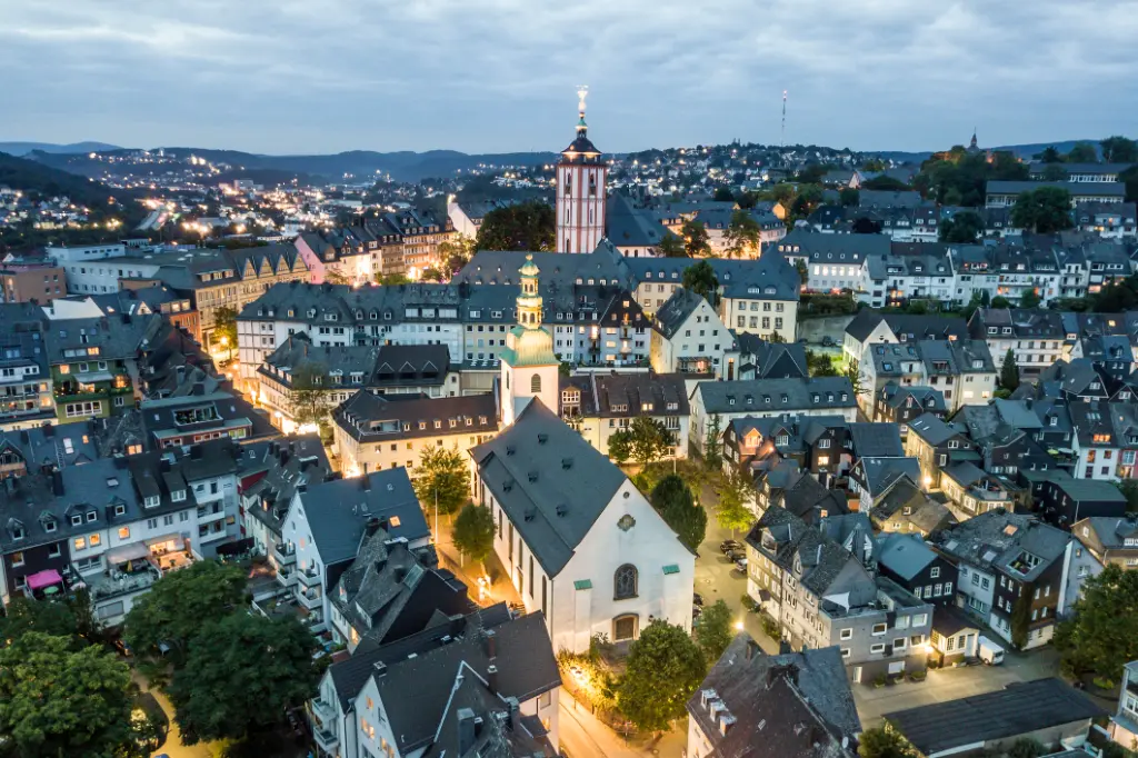 Aerial view over the old town of Siegen at dusk. North Rhine-Westphalia, Germany