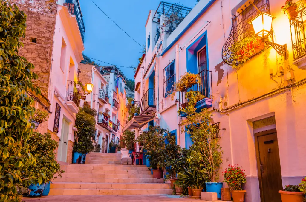 View of colorful houses and narrow streets in the old Mediterranean town of Alicante, Spain
