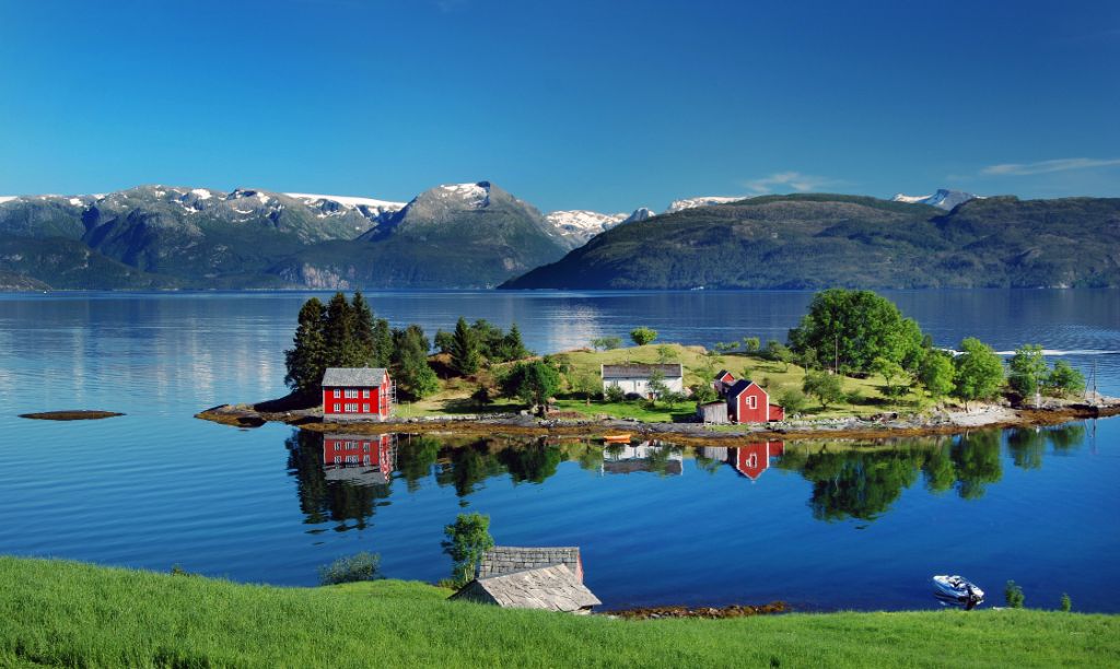 Lonely houses on island in fjord